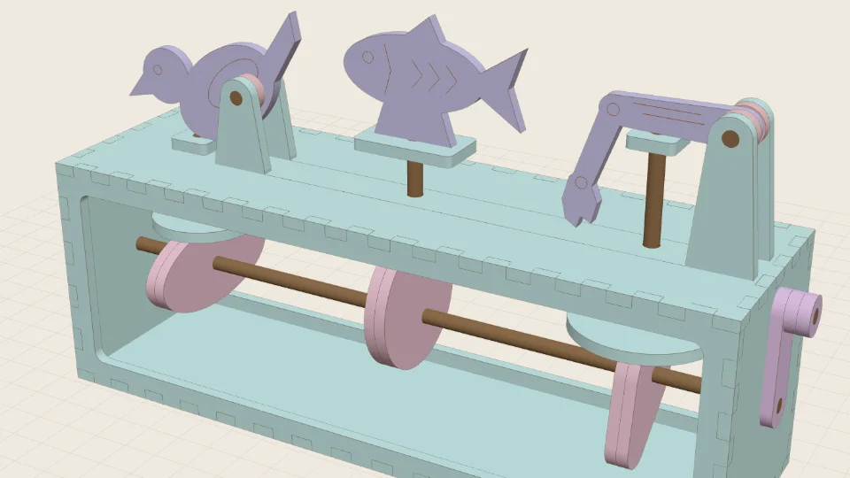 A laser-cut automaton: a box with cams on a shaft and a bird, a fish and a digger arm on top
