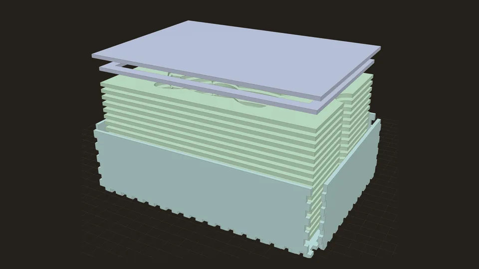 A laser-cut case taken apart: lid, lip, a stack of insert layers with a turtle-shaped cavity, and the finger-jointed box