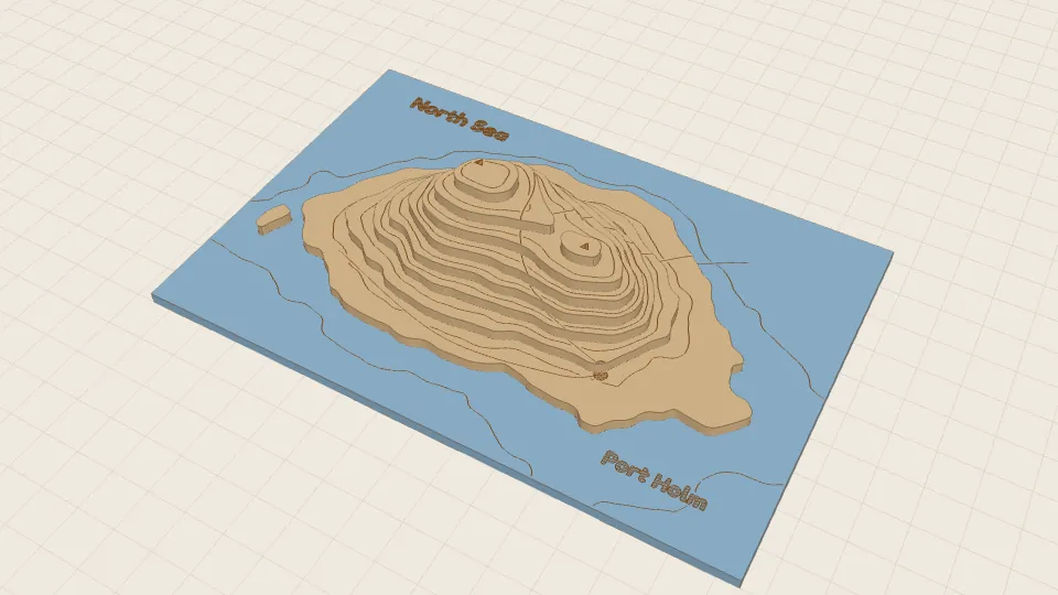 A laser-cut relief map of an island: stacked contour layers on a base, with place names, roads and a river engraved on it